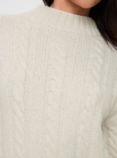 Cable knit sweater  Drop shoulder, ribbed cuff  Good stretch, unlined  Princess Polly Lower Impact  73% reclaimed polyester 24% polyester 3% spandex  Cold hand. wash Cream Turtleneck With Ribbed Cuffs For Winter, Cream Winter Turtleneck With Ribbed Cuffs, Stretch Cable Knit Turtleneck, Stretch Turtleneck Cable Knit Sweater, Funnel Neck Sweater With Ribbed Cuffs For Cold Weather, Cream Ribbed Turtleneck For Winter, Long Sleeve Knit Top With Ribbed Collar, Cozy Cropped Sweater With Ribbed Crew Neck, Soft Knit Stretch Sweater With Funnel Neck