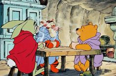 winnie the pooh and tigger sitting at a table talking to each other in front of a fireplace