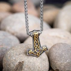 Beautiful Thor's Hammer necklace in 316L stainless steel with gold Celtic knotwork decoration. This pendant is approximately 1.5" (4cm) tall and 1.1" (3cm) wide at its widest point and comes with a matching stainless steel chain in either 20" (50cm) or 28" (70cm) length. The hammer is double-sided with the same design on both sides. Gold Viking Style Necklace For Gift, Hammer Necklace, Thor's Hammer Necklace, Celtic Knot Jewelry, Solid Necklace, Knot Jewelry, Hammered Necklace, Vikings Gifts, Celtic Knot Designs