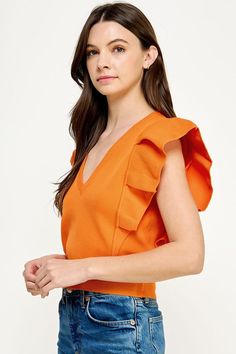 Orange deep V neck knit top with a dramatic pleated cap sleeve. 100% Nylon Sending Love, Pleated Sleeves, Cap Sleeve Top, Pleated Shorts, Vibrant Orange, How To Feel Beautiful, Deep V Neck, Soft Knits, Cap Sleeve