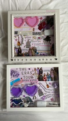 two white frames with pink and purple heart shaped items in them on top of a bed