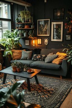 a living room filled with lots of potted plants next to a couch and coffee table