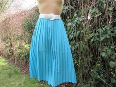 "This pretty pleated skirt  is perfect for spring, autumn and summer! DETAILS: rare skirt pleated skirt midi skirt fabric: silky polyester color: blue  elastic waist Very good condition. Measurements lying flat are: Waist: 16\" / 40,7cm  and more - skirt with elastic waist. Waist max: 18,5\" / 47cm  Length: 30,8\" / 78,1cm PLEASE NOTE: \"Laying flat\" means that \"waist \" NEED TO DOUBLED Size of approximately: EUR44 / 46 X UK16 / 18, but refer to measurements  Belt and blouse in photo are not included." Spring Blue Skirt With Accordion Pleats, Spring Full Skirt With Accordion Pleats, Spring Full Accordion Pleated Skirt, Retro Full Pleated Skirt For Summer, Retro Pleated Full Skirt Bottoms, Retro Pleated Spring Skirt, Retro Spring Midi Pleated Skirt, Spring Full Skirt With Box Pleats, Spring Box Pleat Skirt