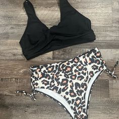 Nwt. Size Large. Top Has Removable Pads. Bottom Is High Waisted With Moderate Coverage. The Cheetah 2 Piece Bikini Swimsuit Is A Perfect Combination Of Classic Style & Modern Sensibility. An Animal Print Bottom Balances Out With A Solid Black Top For A Look That's Both Laidback And Chic. Black Tankini With Built-in Bra For Beach Party, Black Lined Tankini For Vacation, Black High Waist Swimwear With Built-in Bra, High Waist Black Swimwear With Built-in Bra, Black High-waist Swimwear With Built-in Bra, Vacation-ready Black Lined Tankini, High Waist Black Swimwear For Beach Party, Black High Waist Swimwear For Beach Party, Black High-waist Swimwear For Beach Party