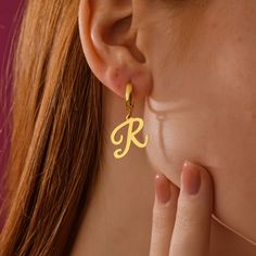 Level up your ears with our totally customizable Initial Letter Huggie Hoop Earrings. These huggie hoops come with tiny letters hanging down, letting you rep your initials or spell out a special message for everyone to see. The minimalist design makes them perfect for everyday wear, adding a touch of personalization to any outfit. Super Features: * Initial Obsession: Choose any letter to rock on your ears, repping your initials or creating a secret message. * Huggie Hoop Love: These comfy huggie Letter Earrings, Earrings Everyday, L Alphabet, Simple Top, Secret Messages, Rock On, Custom Initials, Custom Letters, Earrings Minimalist