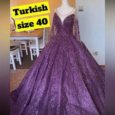 a purple ball gown with sequins on it