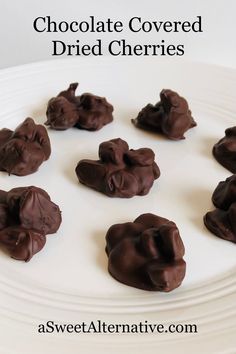 chocolate covered dried cherries on a white plate with text overlay that reads, chocolate covered dried cherries