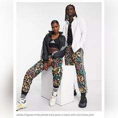 Adidas Originals Pride Printed Track Pants In Black With Love Unites Print Unisex Size Large New With Tags! Casual Multicolor Pants With All Over Print, Casual Multicolor All Over Print Pants, Casual Multicolor All-over Print Pants, Multicolor Sweatpants For Streetwear In Spring, Sporty Multicolor Bottoms With Graphic Print, Spring Streetwear Bottoms With All Over Print, Casual Purple Bottoms With Graphic Print, Black Adidas Pants, Snap Pants