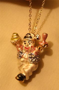 This goldtone necklace features a delightfully petite vintage pendant made in the figural shape of a clown...he is SO cute!  It has pasteled enameling with a shiny finish on the reverse.  It also includes a brooch fitting to allow it to be taken off the chain and worn as a pin if desired.   It measures 1 1/8 inches wide and 1 5/8 inches tall.  The chain is 18 inches and closes with a safety catch and it is in vey nice condition, with some normal vintage wear...adorable! Vintage Gold-plated Tarnish-resistant Charm Necklace, Clown Necklace, Yellow Gold-plated Vintage Charm, Clown Figurines Vintage, Porcelain Clown Dolls Vintage, A Clown, Vintage Pendant, Vintage Wear, Favorite Jewelry