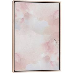 a pink and white wall hanging on a wooden frame