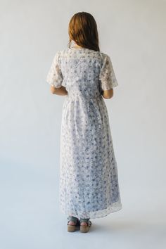 Introducing the Engstrom Floral Midi Dress - a delightful blend of chic and playful. Its elegant ivory bodice pairs perfectly with the feminine lavender floral pattern. Complete with a midi length, this dress is a must-have for any occasion. Details self: 50% viscose + 50% polyester lining: 100% cotton Fabric Care Guide Here Sizing & Fit Measurements are approximate and taken while laying flat across the front. Not doubled. x-small: bust = 18"; length = 51" small: bust = 19"; length = 51.5" medi Elegant White Midi Dress With Ditsy Floral Print, Lavender Midi Dress For Wedding, Lavender Floral Print Short Sleeve Dress, White Modest Dress With Ditsy Floral Print, Lavender Knee-length Dress For Garden Party, Fitted Lavender Midi Dress For Garden Party, Lavender Midi Length Dress For Wedding, Feminine Tea Length Dress For Daywear, Feminine Tea-length Day Dresses