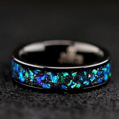 Wood Ring, Damascus Ring, Antler Ring, Camo Ring, Opal Ring, Cubic Zirconia, Turquoise Ring, & Wedding Rings. Check out our selection here: https://www.etsy.com/shop/KingswayJewelry This unique ring beats any conventional ring. Perfect for the outdoors type or anyone looking for a unique ring set that will constantly turn heads. This gorgeous ring set is made of surgical stainless steel. The wedding band is decorated with natural blue, green and purple opal chips. Width - 7 mm NO REFUNDS OR Blue Opal Jewelry For Wedding, Turquoise Wedding Ring Set, Opal Ring Wedding, Purple Wedding Rings, Camo Rings, Turquoise Wedding Rings, Purple And Green Wedding, Opal Wedding Ring, Blue Wedding Band