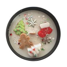 a plate that has some cookies and other items in it on top of snow flakes