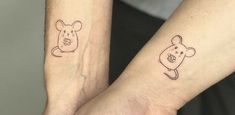 two people with matching tattoos on their arms