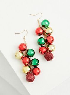 These shaky dangle earrings with red, green, and gold ornaments are perfect for accessorizing during the holiday season. French hook back. Gold tone dangle chains. Base metal. Imported. The best plus size women's red gold and green holiday ornaments shaky dangle earrings in multi. Torrid is your destination for cozy fall and winter clothes to keep you warm and comfortable. Festive Holiday Jewelry With Dangle Shape, Festive Holiday Dangle Jewelry, Festive New Year Dangle Jewelry, Gold Holiday Drop Earrings, Holiday Dangle Jewelry, Festive New Year Dangle Earrings, Festive Dangle Earrings For New Year, Red Dangle Holiday Jewelry, Christmas Party Dangle Jewelry