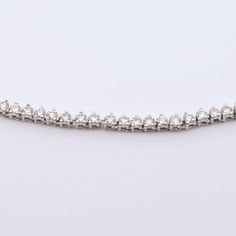 Blend fashion and sport in style with this Tennis Link Necklace. Crafted with diamond-cut links for a touch of sophistication, this timeless piece is the perfect addition to your jewelry collection. Its elegant and tasteful design is sure to make you shine. Available in 14k White Gold & 14k Yellow Gold Natural Diamonds 1.5mm | 2.1 CTW | G-H Color | SI Clarity 18" Necklace Formal White Gold Cubic Zirconia Tennis Necklace, White Gold Tennis Necklace With Diamond Cut, Formal Diamond Tennis Necklace In White Gold, White Gold Diamond Tennis Necklace For Formal, Formal White Gold Diamond Tennis Necklace, Luxury Tennis Necklace With Diamond Accents For Formal Occasions, Luxury Tennis Necklace With Diamond Accents For Formal Events, Formal White Gold Tennis Necklace With Vvs Clarity, Anniversary Diamond Bracelet With Solid Link Construction