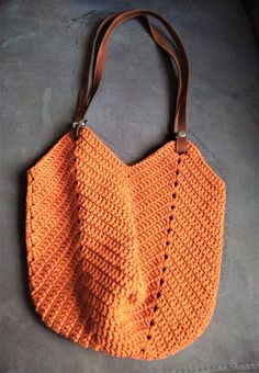 If you want to see my other handmade knit bags; https://www.etsy.com/shop/yarnisland?ref=seller-platform-mcnav&section_id=27294020 This bag is crochet with %100 cotton macrame yarn. It has leather handle. There are removable leather handles with snaps. Boho style is quite fashionable shoulder bag. This round bag would be unique gift to give someone or to buy yourself. Measurement Height : 38 cm, 15 inches Width : 39 cm, 15,4 inches Handles: 78 cm, 31 inches *Ready to ship *3-5 working days a Handmade Orange Shoulder Bag For Everyday Use, Orange Crochet Bag With Braided Handles For Everyday Use, Natural Leather Crochet Bag For Beach, Orange Handwoven Crochet Bag For Everyday Use, Hand Knitted Tote Shoulder Bag For Vacation, Bohemian Hand Knitted Bags For Everyday Use, Handmade Orange Straw Bag For Everyday Use, Everyday Handmade Orange Straw Bag, Natural Leather Crochet Beach Bag