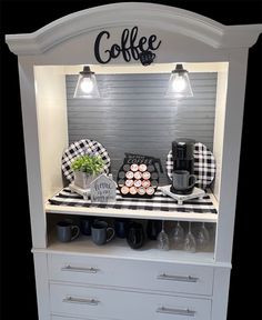 the coffee bar is decorated with black and white decor