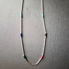 This choker is very comfortable to wear. Perfect for beach day or everyday. Boys or girls will look stylish on this. Necklace is made with 925sterling liquid silver , turquoise, lapis, green ,red and turquoise heishi. Hand-strung by me!! made in the USA. Thank you for looking! https://www.etsy.com/shop/lovelyturquoise Casual Turquoise Jewelry With Tiny Beads, Silver Single Strand Necklace For Beach, Beach Silver Single Strand Necklace, Casual Turquoise Necklace With Tiny Beads, Silver Single Strand Jewelry For Beach, Bohemian Silver Turquoise Necklace For Beach, Southwestern Style Silver Jewelry For The Beach, Southwestern Green Jewelry For Beach, Silver Tiny Beads Necklace For Beach