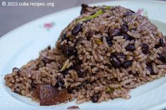 rice and beans are served on a white plate