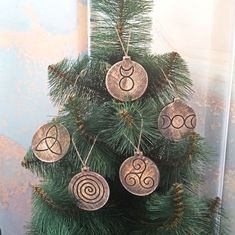 a christmas tree with ornaments hanging from it