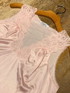 "This is a fabulous vintage Vanity Fair nightgown! Powder pink color with lace trim at bodice and hem. Made in USA Size tag has been removed but we believe this would fit a medium/large. (Model shown is 6 feet tall & wears a size 6/8 dress for sizing) Measurements while laying flat: Bust 21\" or 42\" around Waist 22\" or 44\" around Length 39\" As always, shipping is free to US on orders more than $35 Thank you for looking and we hope to hear from you soon!" Pink V-neck Nightgown With Lace Trim, Vintage Lace V-neck Nightgown, Feminine Sleeveless Lace Patchwork Nightgown, Sleeveless Lace Patchwork Nightgown For Sleep, Coquette Lace Trim Nightgown, Coquette Nightgown With Lace Trim, Vintage Nightgown With Lace Trim For Bedtime, Vintage Nightgown With Delicate Lace For Wedding Night, Feminine Cream Nightgown With Lace Trim