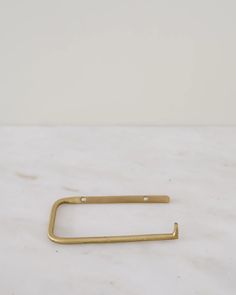 a gold metal object sitting on top of a white counter