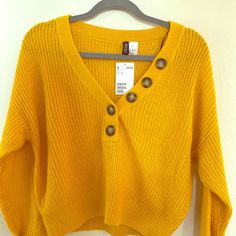 H&M Cute Sweater - Lightweight, Cute Button Detail! Comes In A Shorter Length So Very Flattering With Jeans And Shorts For Spring! Brand New With Tags. Yellow V-neck Top With Button Closure, Yellow Sweater With Button Closure For Spring, Yellow Buttoned Sweater For Fall, Yellow Button Sweater For Spring, Yellow Buttoned Sweater For Spring, Fall Yellow Sweater With Buttons, Yellow Sweater With Button Closure For Winter, Yellow Long Sleeve Sweater With Button Closure, Casual Yellow Sweater With Button Closure