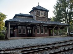 the train station is empty and ready for people to board it on their own tracks