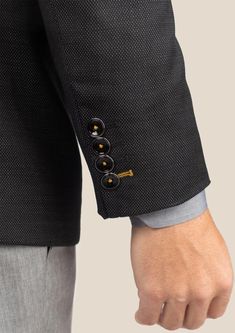 Expertly tailored with an eye catching design, the Black Pindot Jacket exudes timeless sophistication. Cut from premium Super 120s 100% merino wool, its sleek, suave silhouette is custom-made for a premium fit. Elevate your style with this meticulously crafted jacket. Designer Black Wool Blazer, Luxury Black Blazer With Button Cuffs, Black Tweed Jacket With Button Closure For Formal Occasions, Black Tweed Jacket With Button Closure For Formal Events, Luxury Black Tweed Jacket For Business, Elegant Black Tweed Jacket With Button Closure, Modern Black Wool Blazer, Black Tweed Jacket For Business, Black Wool Sport Coat For Office