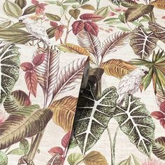 an image of a tropical print wallpaper with birds and leaves on it's surface