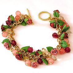 Handmade Pink Flower Bracelet With Gold Toned Chain. Shades Of Pink Beads. Porcelain Jewelry Made By Me From Air Dry Porcelain Clay. Each Pedal Is Molded By Hand To Form The Flowers And Leaves. Please Note That Colors Could Vary Slightly Due To Lighting. Approximate Measurement Size 8.25" Condition: New Never Worn Offers Welcome Cottage Core Jewelry Diy, Pink Flower Charm Bracelet For Jewelry Making, Adjustable Pink Jewelry With Handmade Flowers, Elegant Pink Flower Charm Bracelet, Pink Beaded Flower Charm Bracelet, Pink Bracelets With Flower Decoration As Gift, Pink Bracelets With Flower Decoration For Gift, Pink Flower-shaped Beaded Charm Bracelet, Pink Flower Decorated Bracelet Jewelry