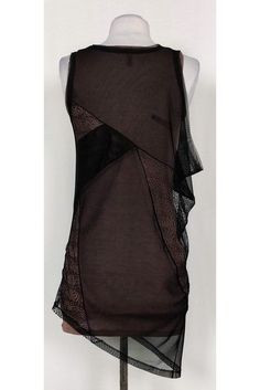 Great for day or night, this chic tank top is a versatile choice. Designed with a taupe tank top lining and an edgy mesh and lace overlay. An asymmetrical hemline tops off the garment. Size XXS Shell: 80% polyester, 20% spandex Contrast 1: 100% nylon Contrast 2: 86% lyocell, 9% wool, 5% spandex Slips on Rounded neckline Mesh & lace overlay Taupe tank lining Bust 23" Shoulder to hem 26" - tank top lining, 33"- overlay Sheer Stretch Tank Top For Night Out, Sheer Sleeveless Top For Night Out, Sheer Sleeveless Mesh Top For Night Out, Sleeveless Sheer Mesh Top For Night Out, Chic Sheer Tank Top For Party, Chic Sheer Tank Top For Night Out, Mesh Tank Top For Night Out, Chic Black Mesh Tank Top, Lace Stretch Tank Top For Night Out