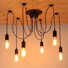 a chandelier with five light bulbs hanging from it's center and four lights attached to the ceiling