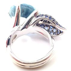 a ring with blue and white stones on it