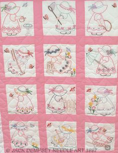 a pink quilt with embroidered pictures on it