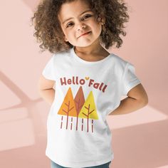 "Hello Autumn Organic cotton kids t-shirt clothing. Check out matching \"Hello Fall design adult t-shirt\": https://www.etsy.com/listing/1054384063/hello-fall-simple-autumn-tree-design?ref=shop_home_active_2&pro=1&frs=1 Put your kids in a t-shirt that's cute, super comfortable, and made of natural fabrics! This 100% organic cotton tee is sure to become their favorite! * 100% organic ring-spun combed cotton * Fabric weight: 4.57 oz/yd² (155 g/m²) * Single jersey * Medium fit * Set-in sleeves * 1× Fun White T-shirt For Fall, Playful Pre-shrunk T-shirt For Fall, Playful Crew Neck T-shirt For Fall, Playful Short Sleeve T-shirt For Fall, Playful Short Sleeve Fall T-shirt, White T-shirt For Fall Family Matching, Fall Graphic Tee, Winter Tees, Fall Graphic