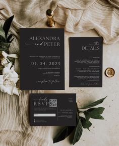 two black and white wedding stationery with flowers