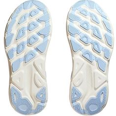 the bottom view of a pair of blue and white shoes