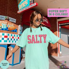 This Salty beach shirt is the perfect t-shirt for your summer vacation! Our Comfort Colors tees are super soft, DTG printed (printed with ink), and 100% cotton. ❗❗There may be a slight difference in the colors due to different monitors. ❗❗ 🌞 HOW TO ORDER 🌞 * Select your size and color from the drop-down menu * Add your shirt to cart. If you would like more than one, add each one to cart individually. * Proceed to check out! * Your shirt will be ready to ship in 1-3 days! 🌞 SIZING 🌞 Check the Fun Green T-shirt For The Beach, Beach Season Short Sleeve T-shirt For Day Out, Green Letter Print T-shirt For Vacation, Trendy Green T-shirt For Vacation, Green T-shirt For A Summer Day Out, Green T-shirt For Summer Day Out, Casual Camp Shirt With Funny Print For Summer, Fun Summer Camp Shirt With Short Sleeves, Summer Camp Shirt With Funny Print And Short Sleeves