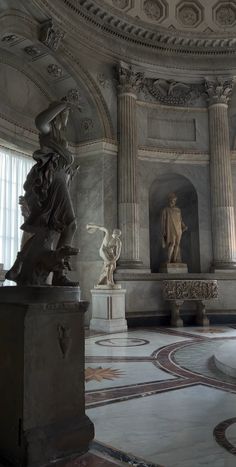 a statue in the middle of a large room