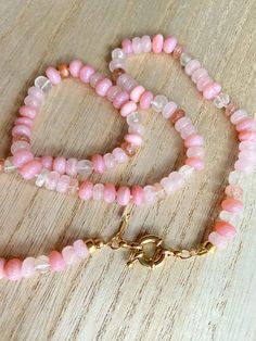 This beautiful pink gemstone necklace makes a perfect gift! Each bead is hand knotted onto silk thread, which gives the necklace a lovely drape.Necklace is 21 inches long, hand knotted with white silk string, gold filled beads, and has gold filled clasp. This is a stunning necklace that completes any outfit. This necklace is a perfect gift!   GEMSTONES  Pink Opal (dyed) Sunstone Rose Quartz Aquamarine Gold Filled Findings BENEFITS OF A HAND KNOTTED NECKLACE 1. A knotted necklace is safe and secu Luxury Hand-knotted Beaded Necklaces As Gift, Rose Quartz Beaded Necklace With Faceted Beads As Gift, Handmade Rose Quartz Beaded Necklace With Round Beads, Pink Healing Faceted Bead Necklaces, Healing Pink Faceted Bead Necklaces, Pink Faceted Beads Necklace For Healing, Beaded Rose Quartz Crystal Necklace, Adjustable Rose Quartz Round Bead Necklace, Beaded Rose Quartz Necklaces With Faceted Round Beads