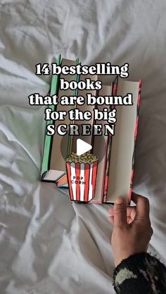 someone is holding up a book with the title, 12 best selling books that are bound for the big screen