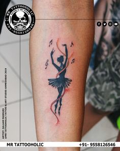 a tattoo on the leg of a woman with musical notes and a ballerina in black