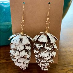 These Snow Flocked Pine Cone Earrings Are A-Mazing!!! They Look Real And No Two Are Exactly The Same. They Are Not Flat, This Is A 3-D Little Pine Cone. They Could Also Double As Really Great Tree Ornaments! Great For Christmas Or To Wear All Winter Long! All My Earrings Include Backs. Drop Length Is Approx 2.5.” Width Is Approx 1.��” All Jewelry In My Closet Is Buy 2, Get 1 Free!!! To See My Full Selection, Type “Jewelry” In The Search Bar At The Top Of My Closet. Includes Sets And Seasonal Holid Pine Cone Earrings, Football Earrings, Turquoise Western, Gold Chandelier Earrings, Ear Crawler Earrings, Oval Stud Earrings, Ear Pins, Prom Jewelry, Link Earrings