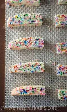 sprinkles and sugar on top of a cookie sheet ready to go into the oven