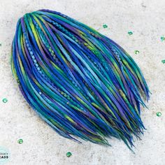 Mermaid hair color ideas #wooldreads #woolextensions #boholucydreads Mermaid Hair Color Ideas, Pastel Blue Hair Extensions, Mermaid Dreads Dreadlocks, Braids And Beads, Blue Green Mermaid Hair, Diy Double Ended Synthetic Dreads, Macrame Dreadlock Beads, Dreadlocks Extensions, Mermaid Hair Color