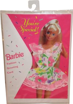 the barbie doll is wearing a pink dress