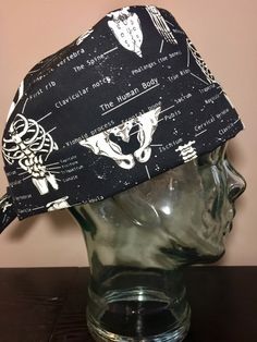 Bones of the Body Orthopaedic Surgical Scrub Hat, Glow in the Dark Women's Skeleton Pixie Scrub Hat, Tie Back Cap, Custom Caps Company by CustomCapsCo on Etsy https://www.etsy.com/listing/502022739/bones-of-the-body-orthopaedic-surgical Adjustable Cotton Hat For Halloween, Adjustable Cotton Halloween Hat, Fitted Black Themed Hat, Adjustable Themed Black Hat, Themed Adjustable Black Hat, Bones Of The Body, Xiphoid Process, Pixie Scrub Hat, First Rib