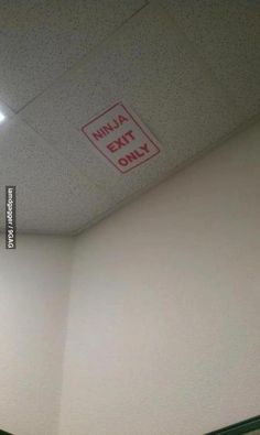 an empty room with no entry sign on the ceiling